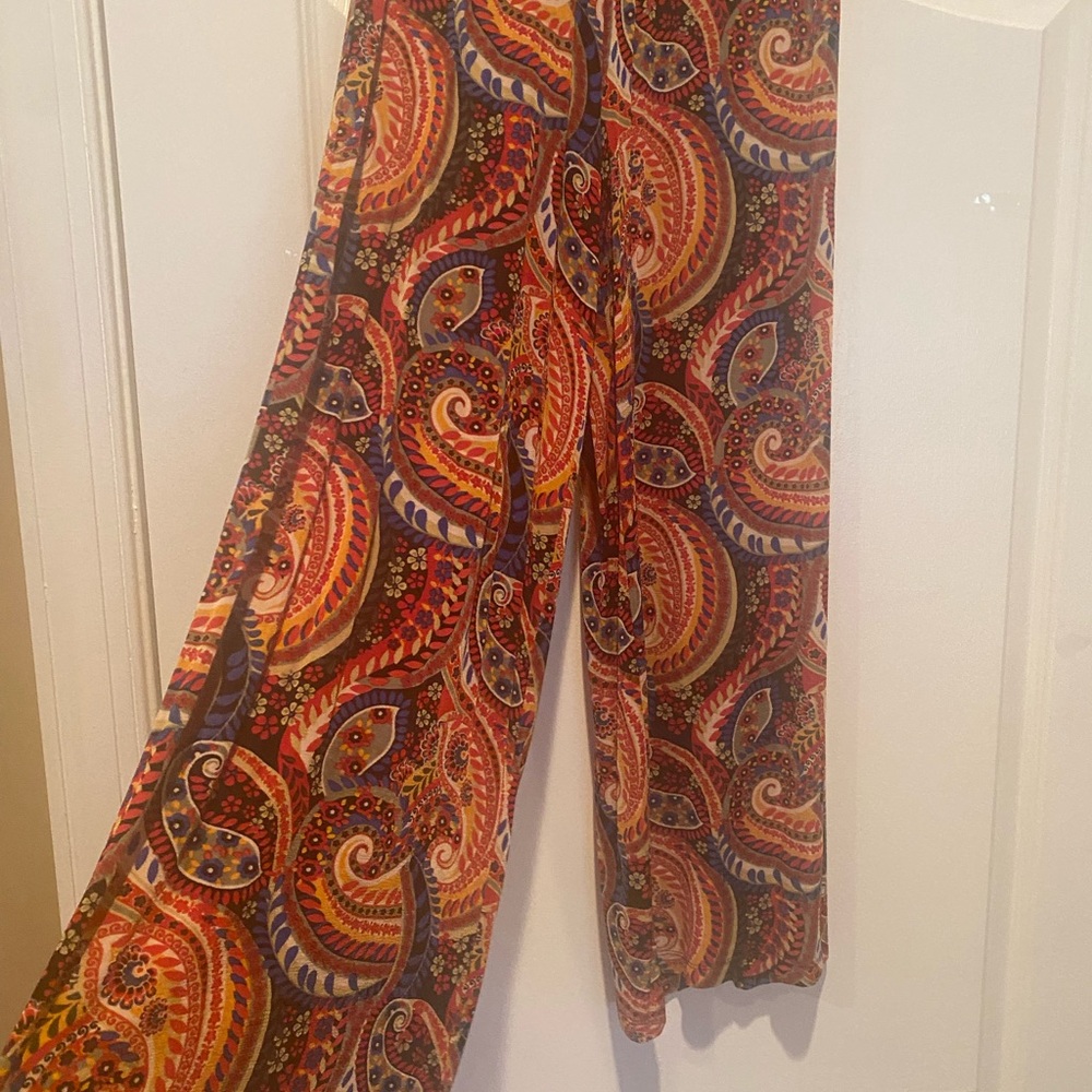 Wide legged pants. Elastic waist. 40.5 inches in length. Multi colored.